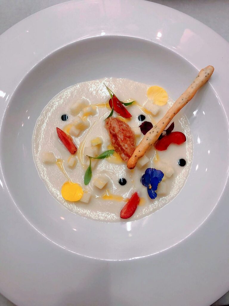 Cold soup with crab and edible flowers by chef Javi Puig